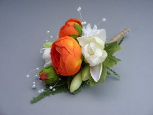 Corsage - Tuberose, Orange Ranunculus, Pearl Loop and Baby's Breath - from £9.00
