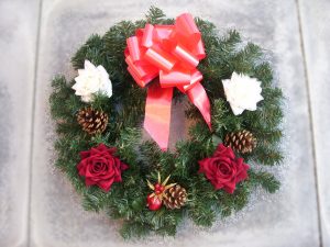 18” Wreath - Red & White Roses, Cones, Poinsettia & Cone Pick & Red Bow - from £17.00